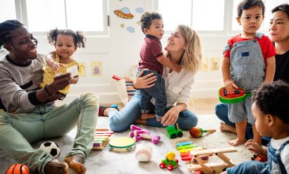 Children enjoying playing with toys with their caregivers